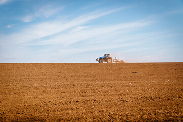 tractor ploughing field