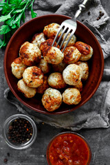 Chicken meatballs in a plate. Meatballs and basil. Copyspace. Top view.