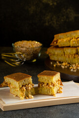 Kue Hok Lo Pan or martabak bangka. The martabak bangka batter is made from a mixture of flour, eggs, sugar, baking soda, coconut milk and water.The batter is cooked upon a thick round iron frying pan 
