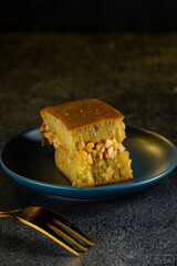 Kue Hok Lo Pan or martabak bangka. The martabak bangka batter is made from a mixture of flour, eggs, sugar, baking soda, coconut milk and water.The batter is cooked upon a thick round iron frying pan 