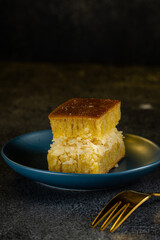 Kue Hok Lo Pan or martabak bangka. The martabak bangka batter is made from a mixture of flour, eggs, sugar, baking soda, coconut milk and water.The batter is cooked upon a thick round iron frying pan 