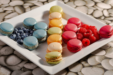 delicious raspberry and blueberry macaroon in a plate -1