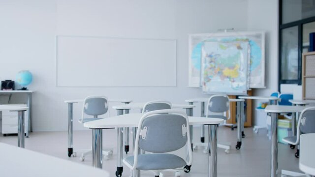 videoblocks desks in unconventional classoom interior of private school