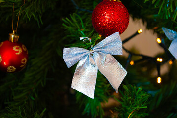 christmas decor, toys, bows, glass balls, bokeh, background, toys, merry christmas, happy new year. 2022. Lights, sparkles and glare, snow. 