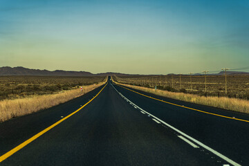 Road through beautiful karoo countrysides, rolling hills and meadows South Africa