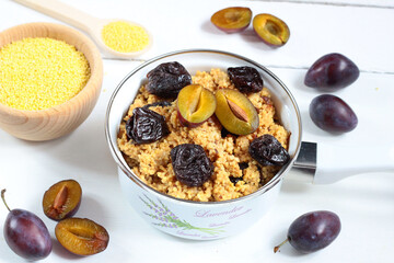 Millet with plums. A warm autumn breakfast