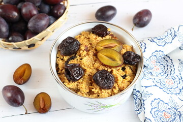 Millet with plums. A warm autumn breakfast