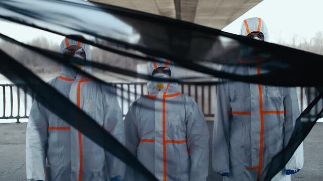 videoblocks people with protective suits and respirators outdoors coronavirus and death concept