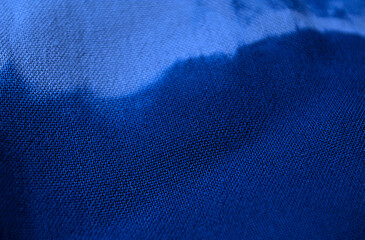 Indigo frame textile background, process dye fabric indigo color, fabric texture close up.