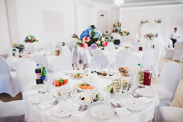 Delicious sweets on wedding candy buffet with desserts, cupcakes