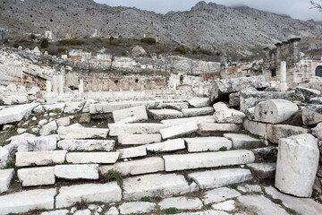 ruined white marble staircase on the main street of abandoned ancient city Sagalassos lost in Turkey mountains