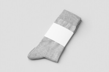 Light grey socks mockup with blank label.