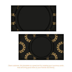 Black business card with brown Greek ornament