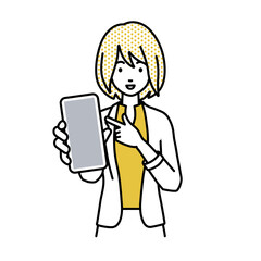 立ってスマートフォンを指差してこちらに向けて見せているジャケットの女性