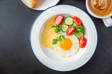 breakfast fried eggs and a cup of coffee liquid egg yolk fresh portion ready to eat meal snack on the table copy space food background rustic. top view keto or paleo diet veggie or vegetarian