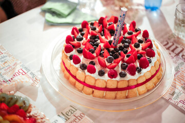 fruit cake with cream and blueberries
