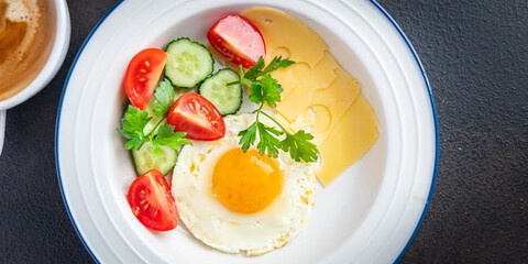 breakfast fried eggs and a cup of coffee liquid egg yolk fresh portion ready to eat meal snack on the table copy space food background rustic. top view keto or paleo diet veggie or vegetarian