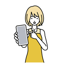 立ってスマートフォンを指差してこちらに向けて見せているドレスの女性