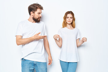 man and woman in white t-shirts jeans fashion casual style
