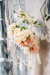 Floral Design Dress, floral fashion, flower dress. Flower arrangement delicate delicate pastel peonies and roses in the form of female figures on a frame. Flower shop decoration