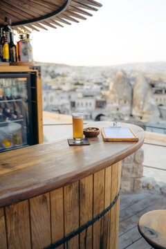 Glass of beer at counter in bar