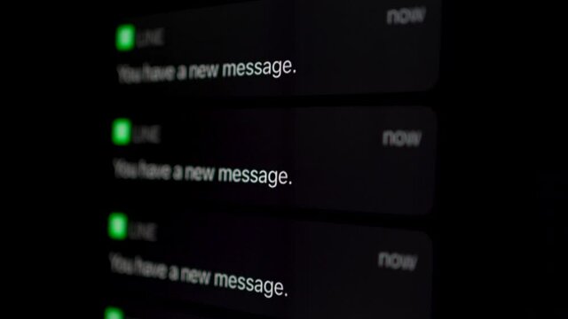 Black mobile phone screen notifies that there is a new message. 5G technology.