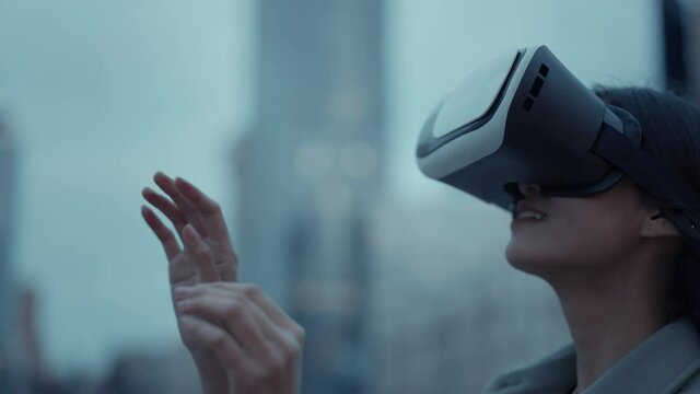 Side view of asian woman standing on street in VR headset