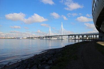 Beautiful white bridge over the river in the autumn morning in the city