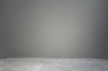 new concrete wall, fine mortar plastered wall with dirty grunge floor at construction site