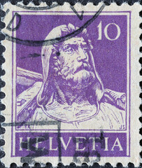 Switzerland - Circa 1930: a postage stamp printed in the Switzerland showing Swiss freedom fighter Wilhelm Tell with a crossbow . purple  10 Rp - obrazy, fototapety, plakaty