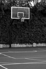 Red basketball hoop with net. Monochrome photography. Sport concept