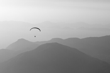 Paraglider over the mountains