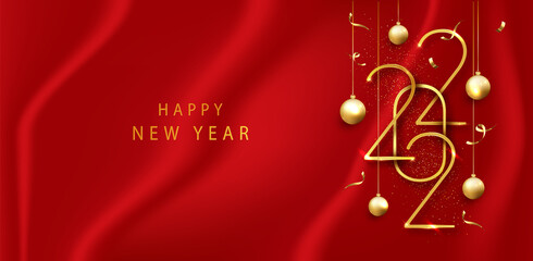2022 Happy new year with gold numbers on red cloth background. Hanging Golden metallic numbers 2022. New Year greeting card or banner template
