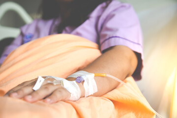 Obraz na płótnie Canvas Close up patient hand with saline intravenous (iv)