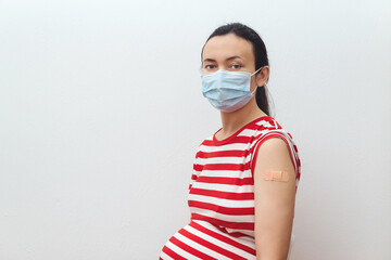Young pregnant woman getting the coronavirus vaccine. Coronavirus vaccination advertisement....
