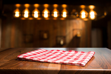 Napkin and board for pizza on wooden desk. Stack of colorful dish towels on white wooden table background top view mock up. Selective focus. - 457561320
