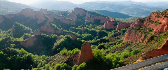 Beautiful landscape with red mountains and green fields. Las Medulas, Leon, Castilia, Spain. Europe
