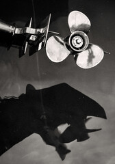 Abstract vertical image of speed boat propellor and it's reflection in the water,Perast,Montenegro.