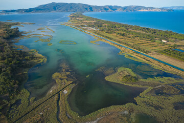 aerial view of the western lagoon with a view of mount argentario