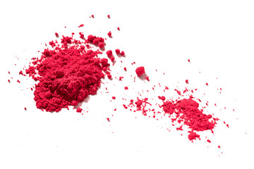 Close up of a large and a small portion of red pigment isolated on white in side view. The pigment...
