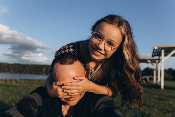 Father and daughter share love, have fun in park. Family outdoor vacation together. Happy Father's Day!