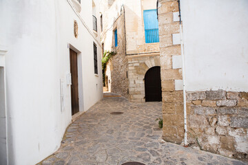The architecture of the island of Ibiza. A charming empty white street in the old town of Eivissa