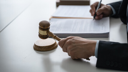 Lawyer Legal counsel presents to the client a signed contract with gavel and legal law. justice and...