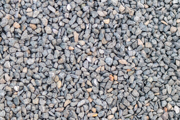 Raw rocks and minerals as natural stones background with crushed and rough material at a rough coast or rocky beach show nuggets and sandstones in harmonic pastel colors as natural mineral background