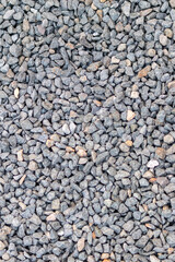 Raw rocks and minerals as natural stones background with crushed and rough material at a rough coast or rocky beach show nuggets and sandstones in harmonic pastel colors as natural mineral background