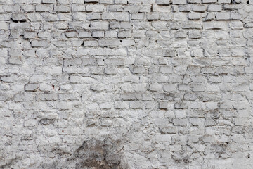 Solid wall with white bricks in vintage style as grey stonewall background or wallpaper with urban house architecture seamless aged in rectangle tiled stone texture and modern rough surface material