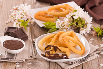 Churros with chocolate dipping sauce.