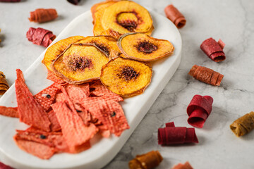dried fruits and pastille on a marble background