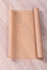 parchment. baking paper on a wooden background in retro style. close-up.