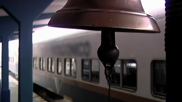 Vintage Bell Rings to Signal Train Departure in Patagonia, Argentina - Close Up